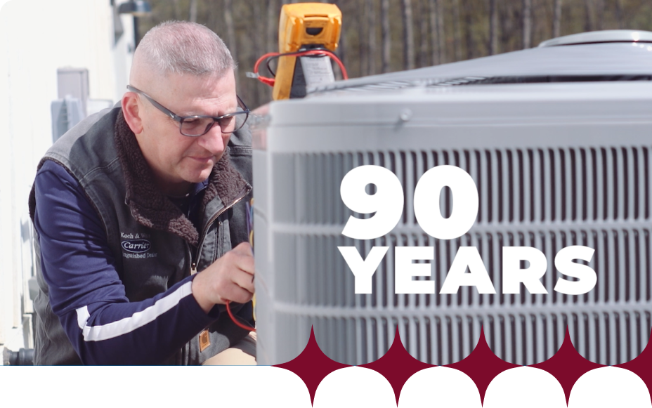 Koch & White technician repairing an air conditioner